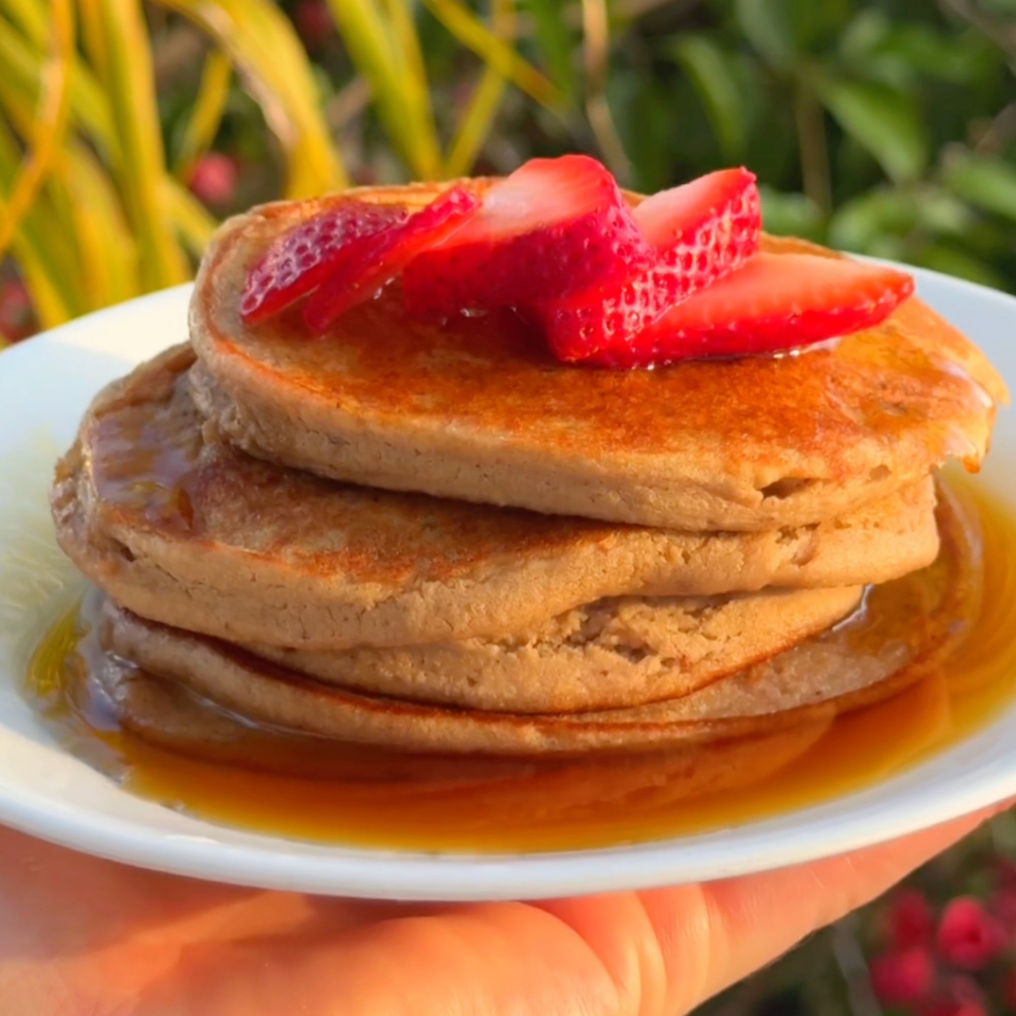 pancakes topped with strawberries on a plate